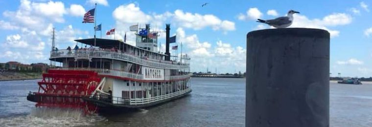 Steamboat Natchez paddling down the New Orlans river.